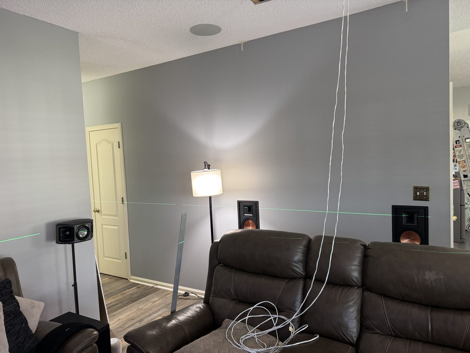 In-wall speakers set to the laser line
